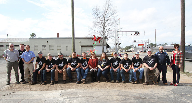 Wiregrass SkillsUSA students and instructors in front of Daylily Garden in Adel.